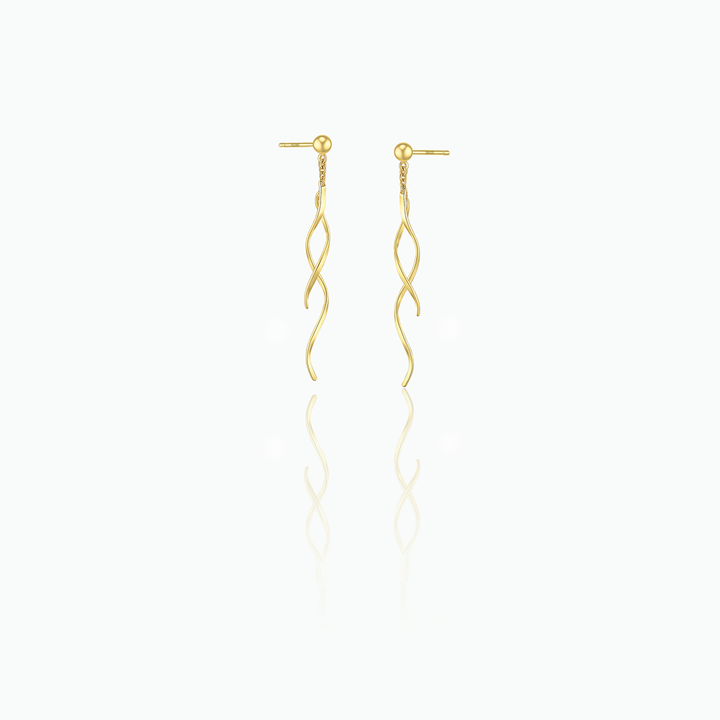 Gold earrings with wavy design on a white background