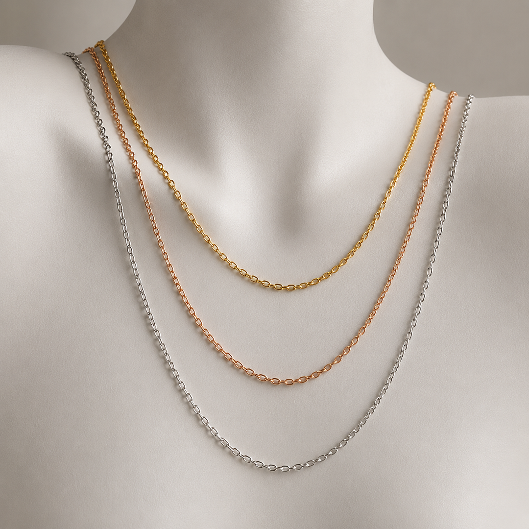 gold rose gold and silver necklace chains layered at different lengths on a mannequin