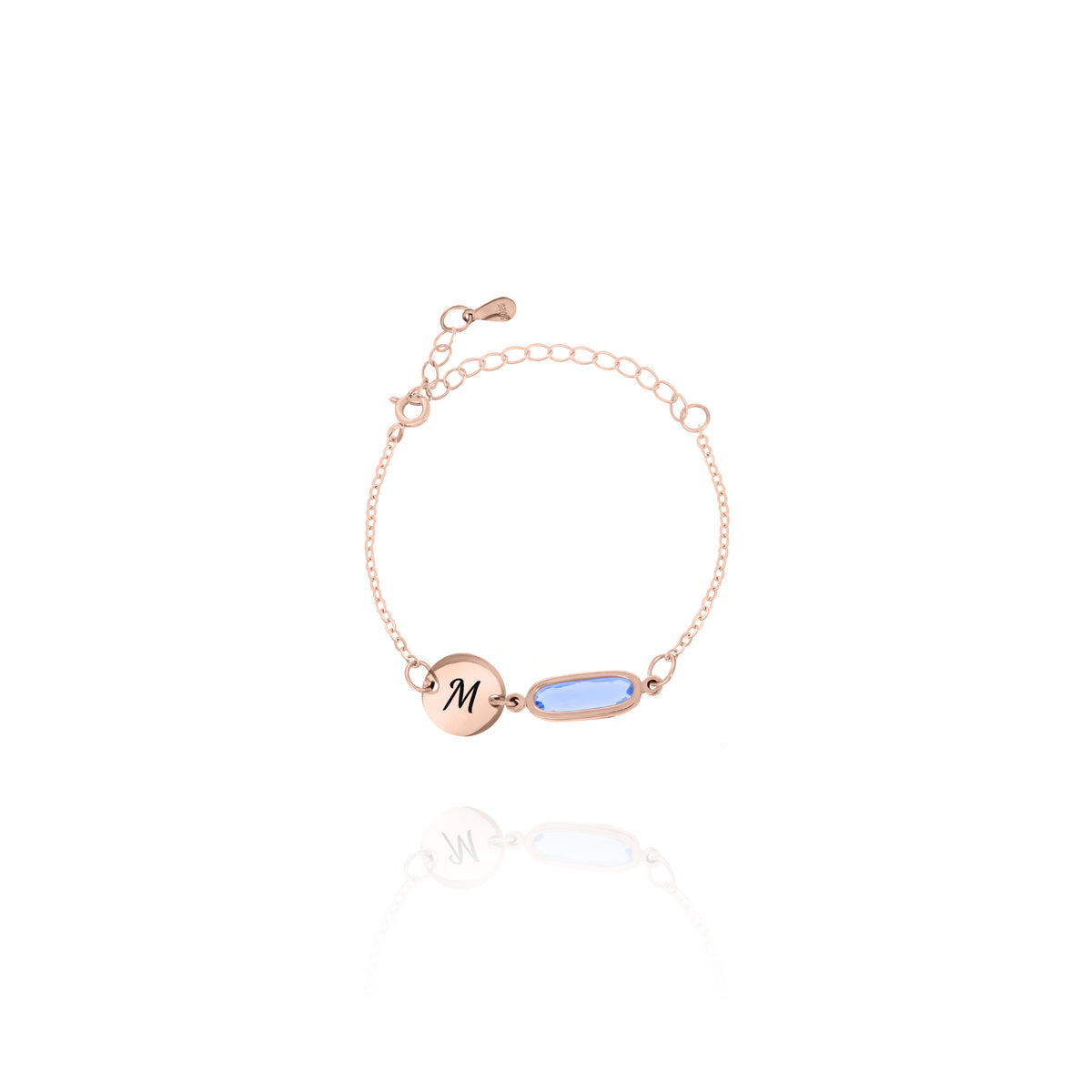 Rose-gold-tone bracelet with engraved M initial disc and pale blue elongated rectangular stone on white background