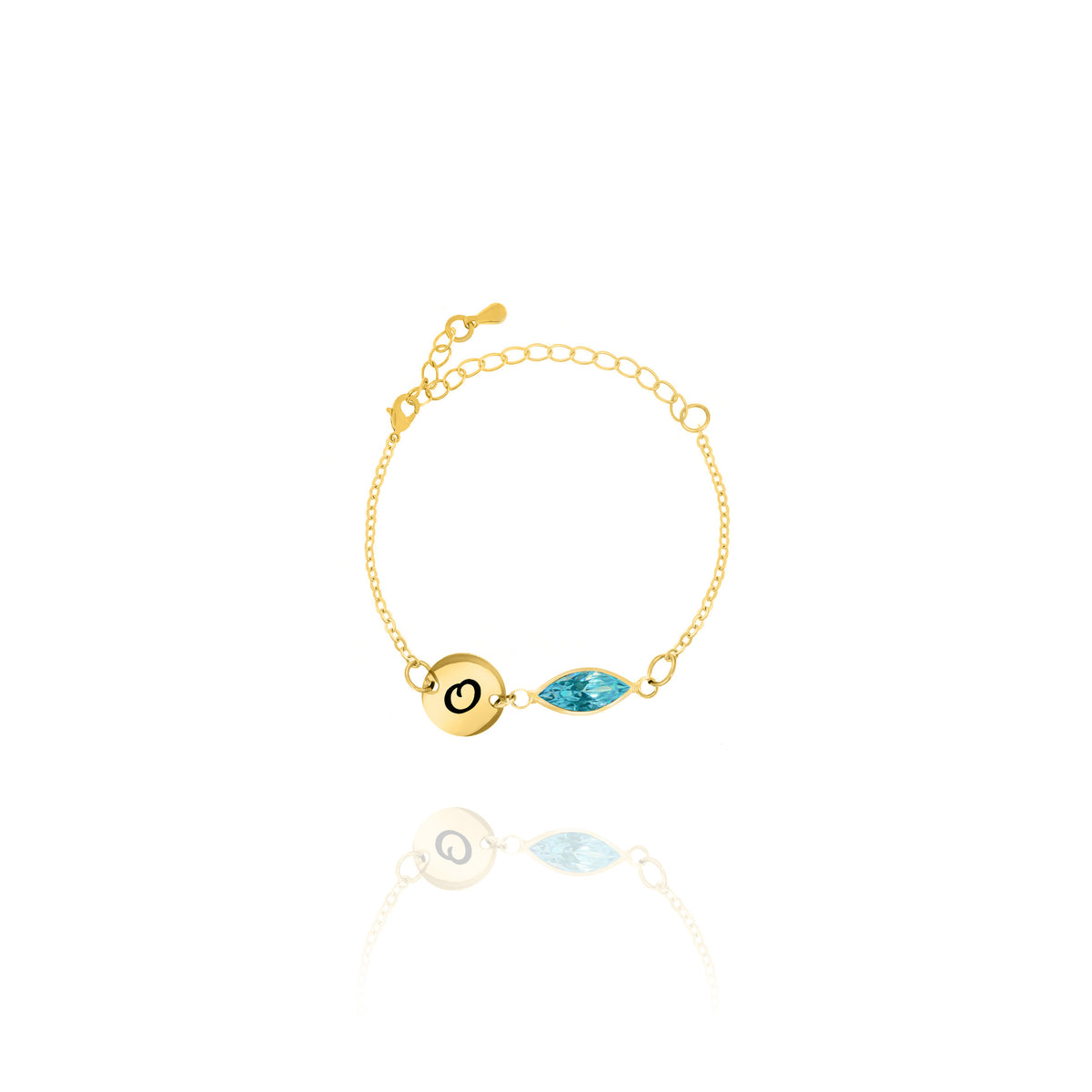 Gold-tone bracelet with engraved O initial disc and light blue faceted marquise-shaped stone on white background