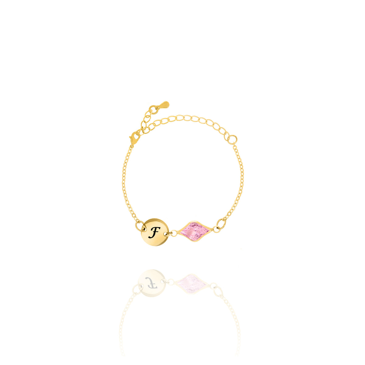 Gold-tone bracelet with engraved F initial disc and pink faceted marquise-shaped stone on white background