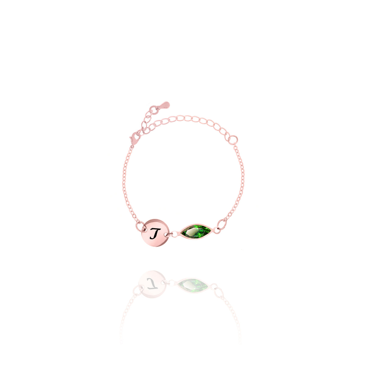 Rose-gold-tone bracelet with engraved J initial disc and green faceted marquise-shaped stone on white background