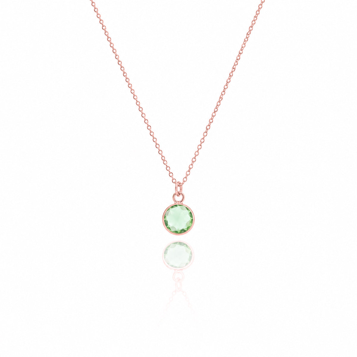 Rose-gold-tone necklace with a round green stone pendant displayed on a white background
