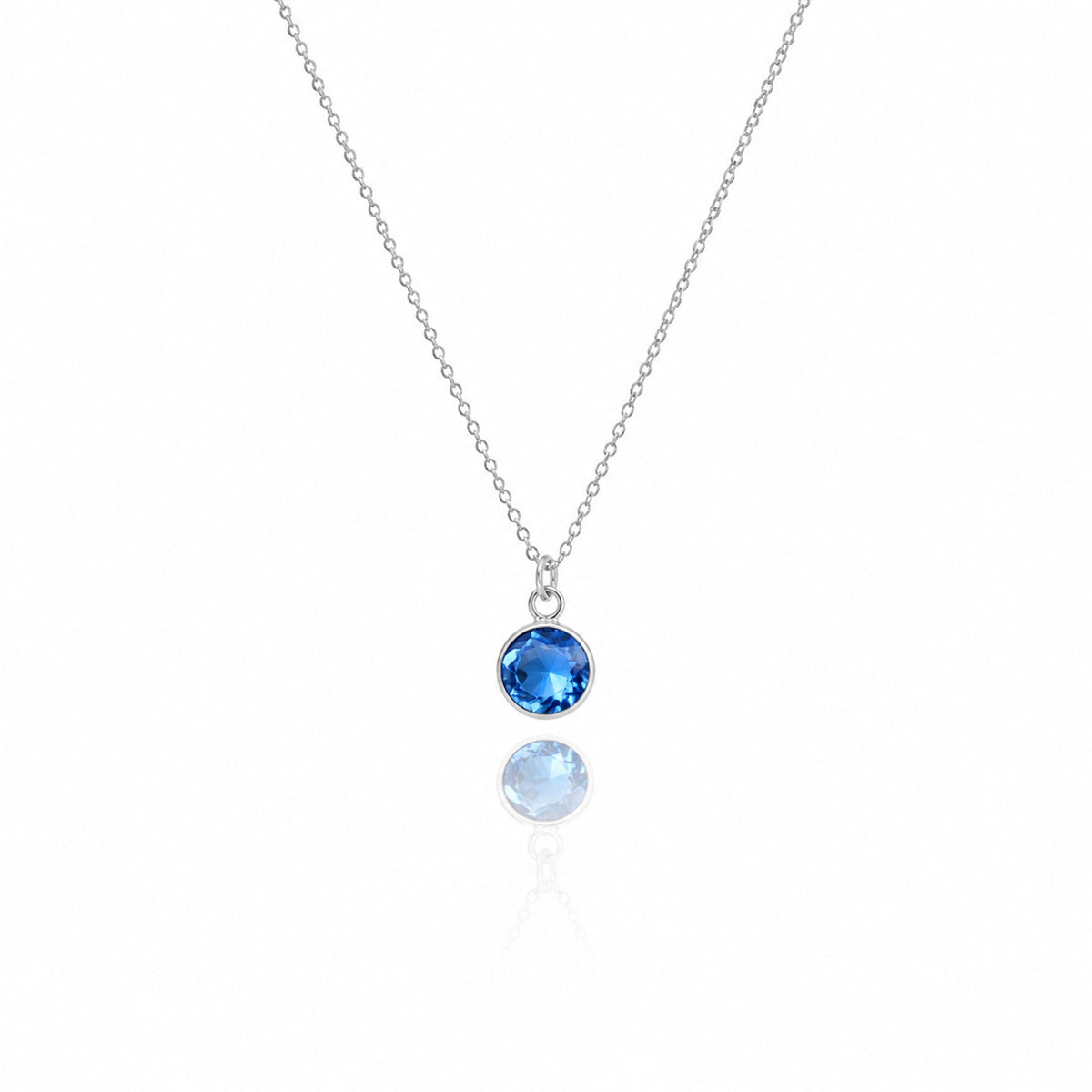 Silver-tone necklace with a round blue stone pendant displayed on a white background