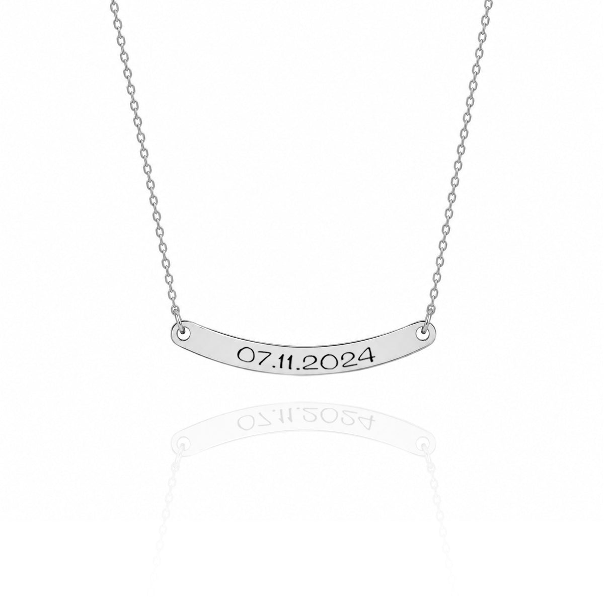 Silver-tone curved bar necklace engraved 07.11.2024 on a white background