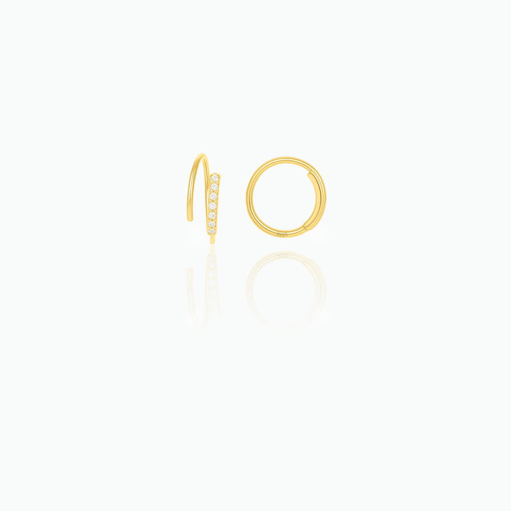 Gold hoop earrings on a white background