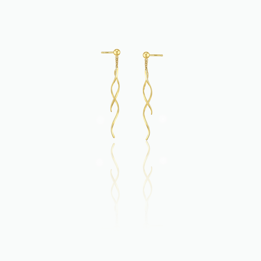Gold earrings with wavy design on a white background