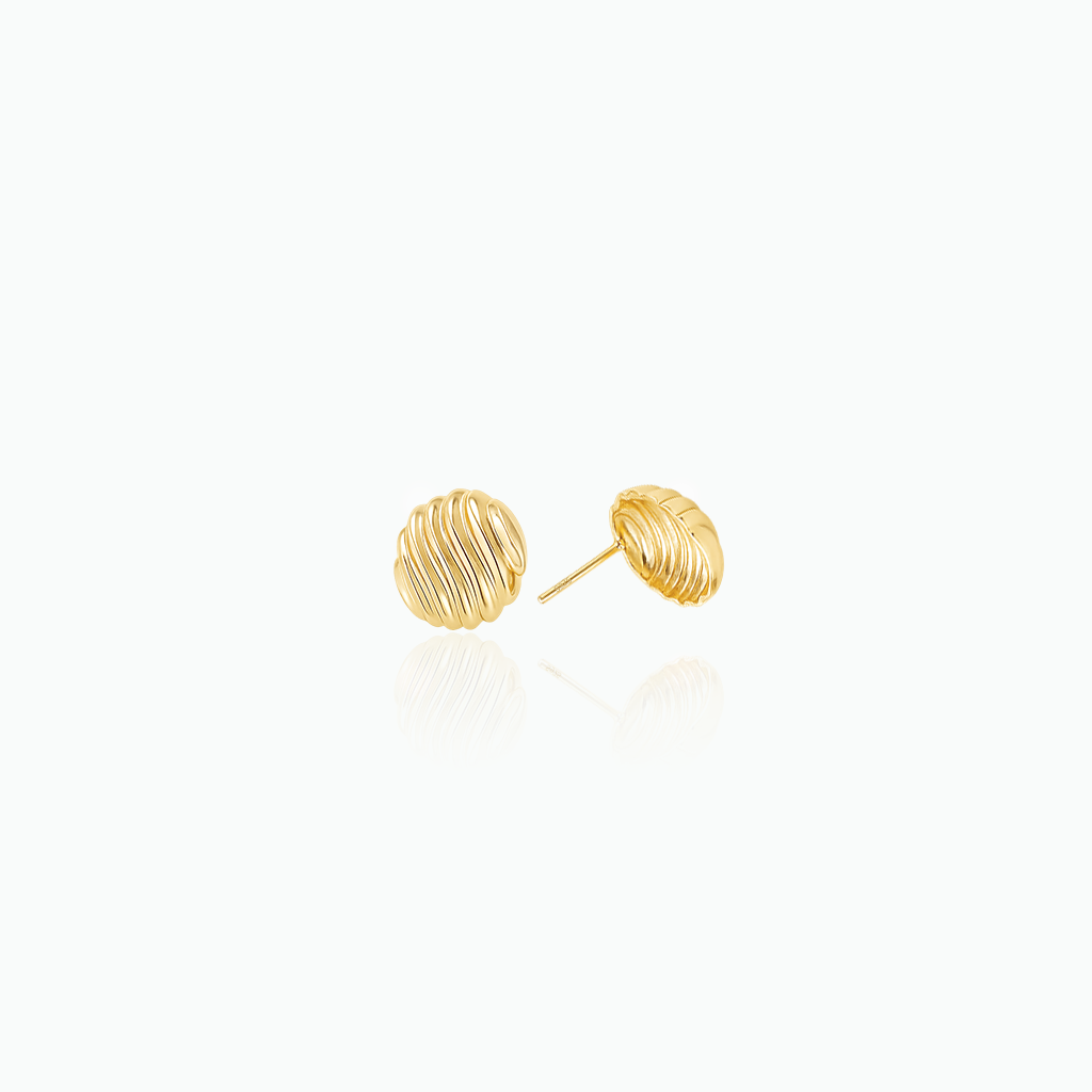 Gold stud earrings on a white background
