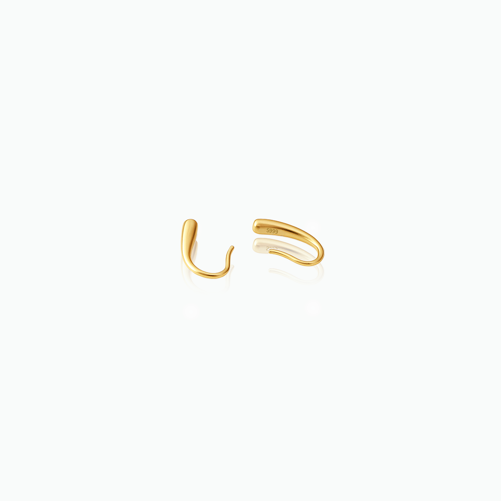 Gold hoop earrings on a white background