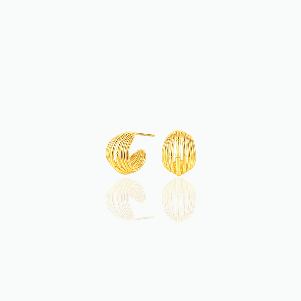 Gold hoop earrings on a white background