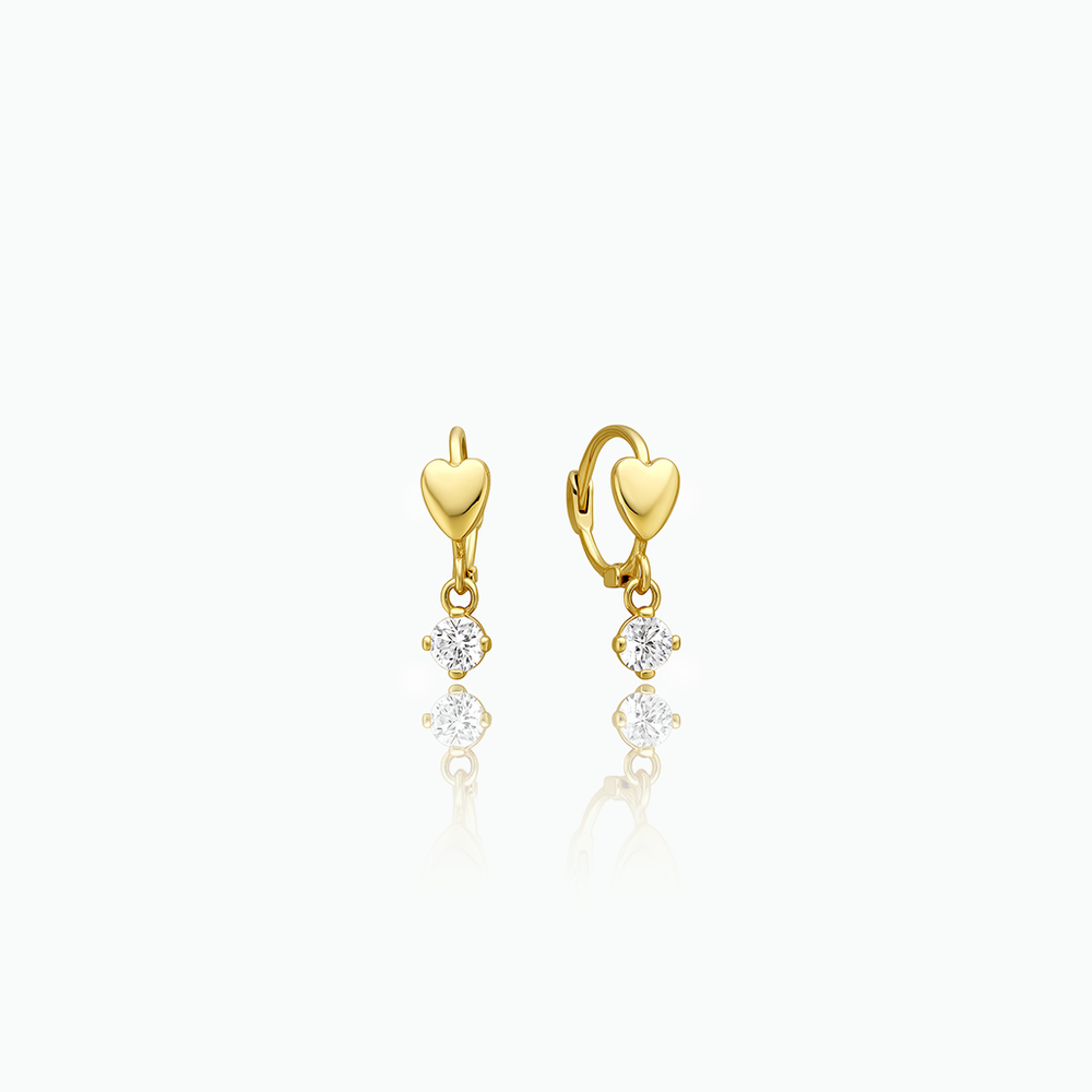 Gold heart-shaped earrings with small diamonds on a white background