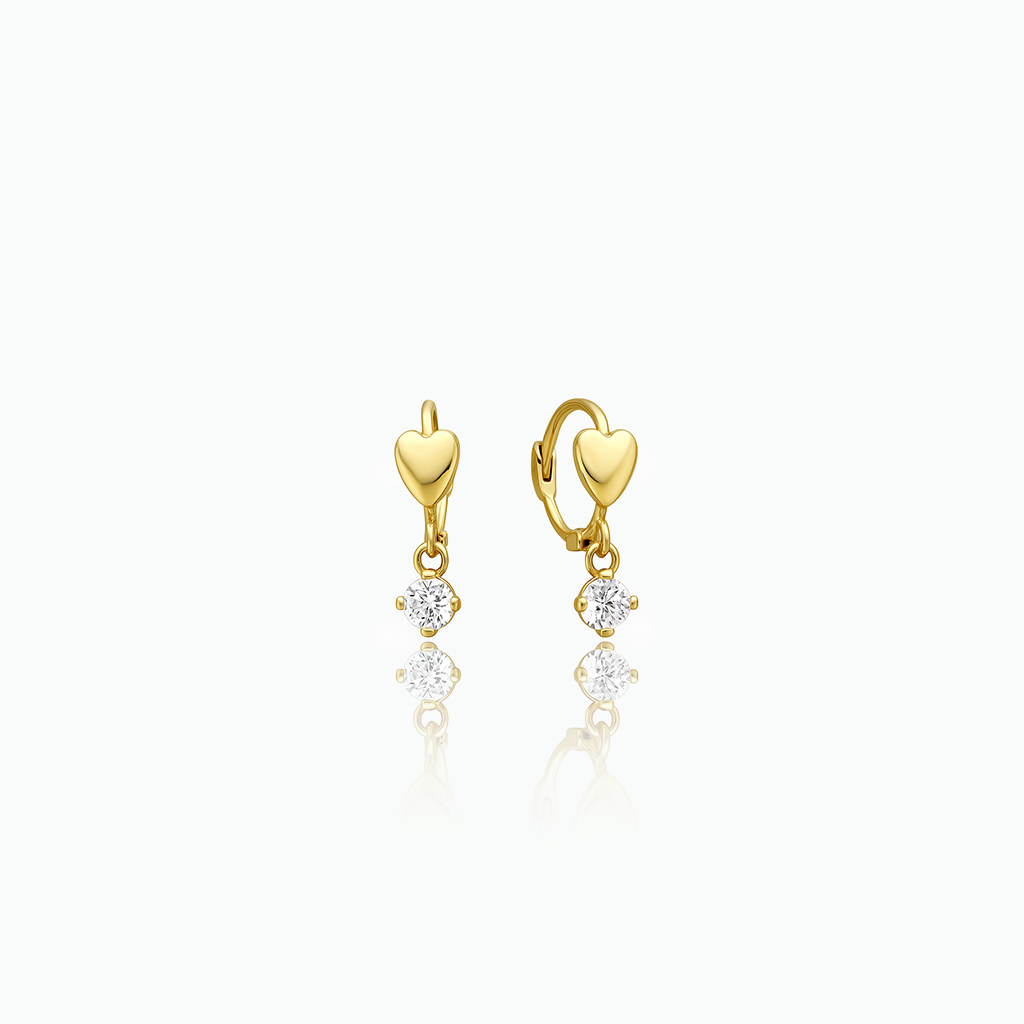 Gold heart-shaped earrings with small diamonds on a white background