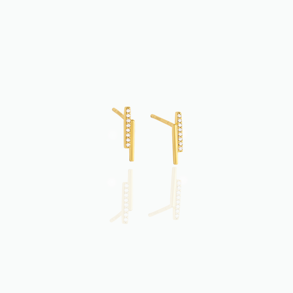Gold earrings on a white background
