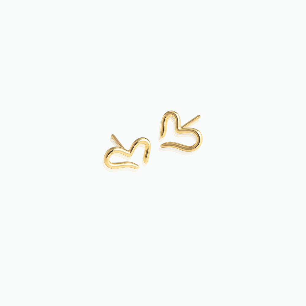 Gold heart-shaped earrings on a white background