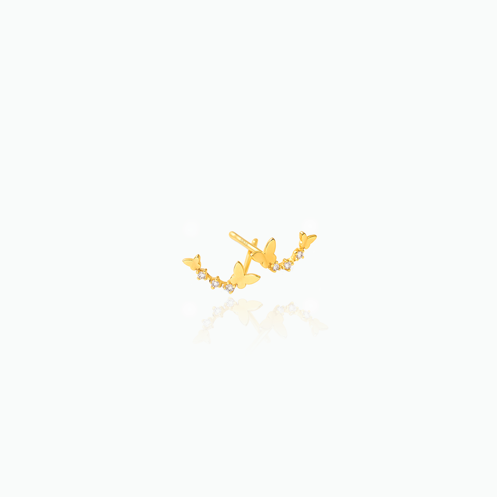 Gold earring on a white background