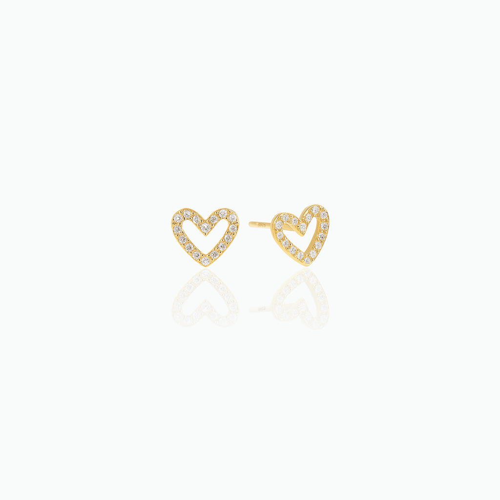 Gold-tone open heart stud earrings with clear stones displayed on a white background