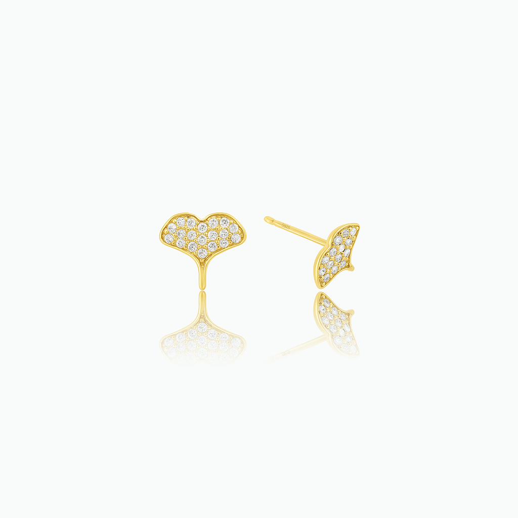 Crystal-set whale tail stud earrings shown from front and side on a white background