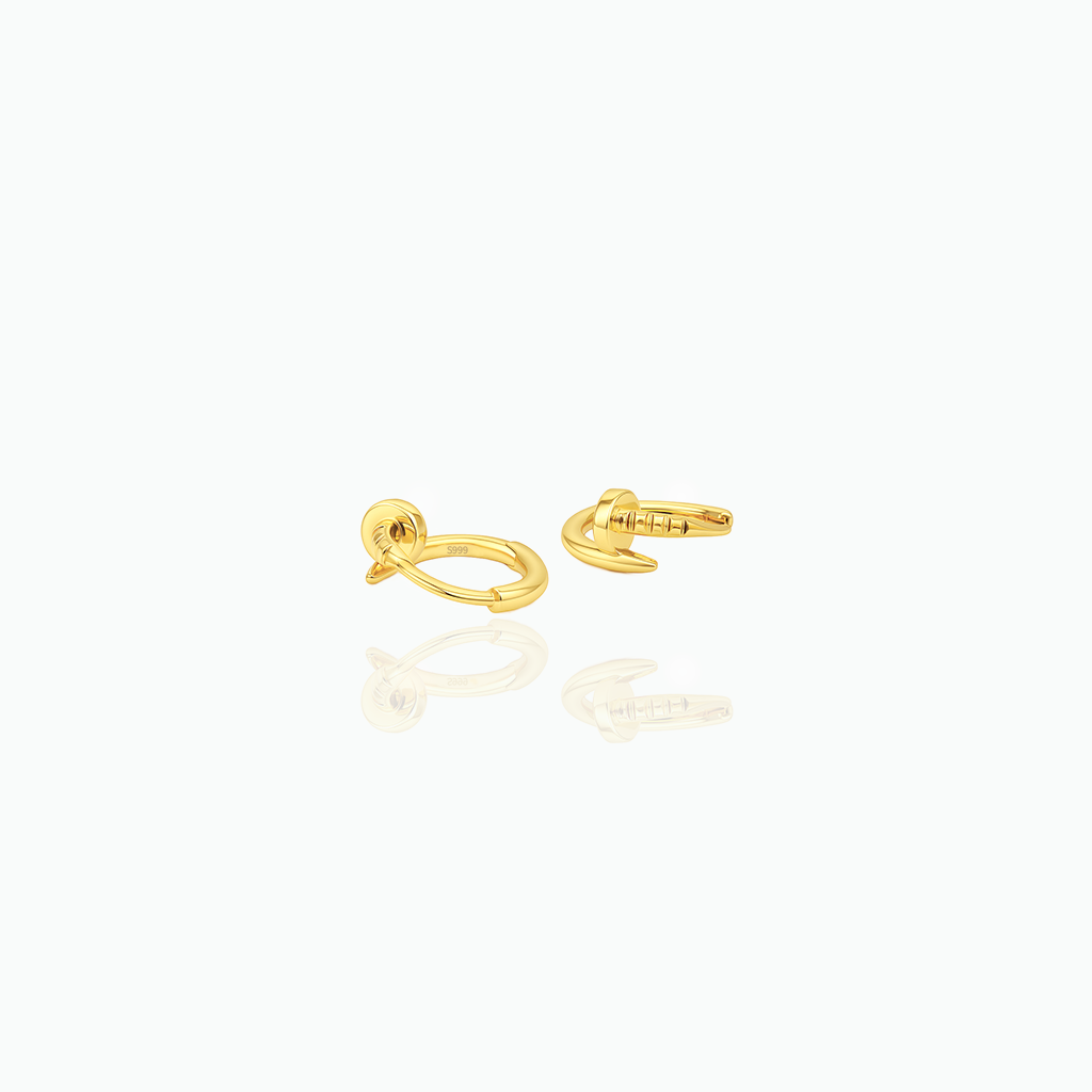 Gold earring on a white background