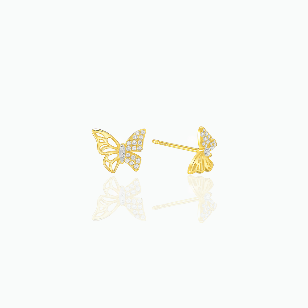 Gold butterfly earrings with diamond accents on a white background