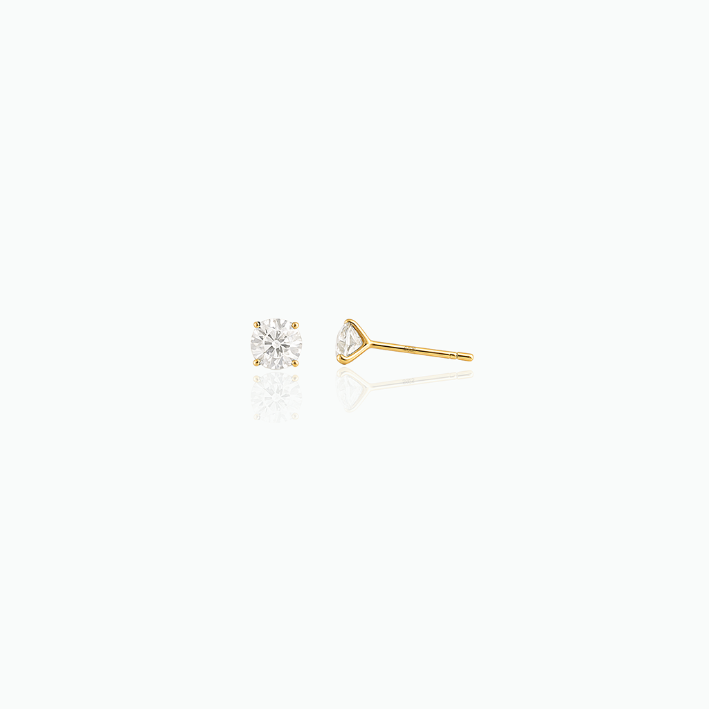 Two diamond stud earrings on a white background