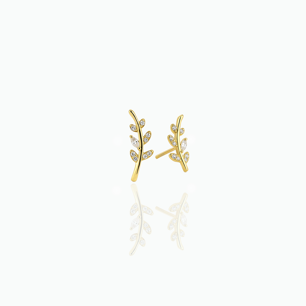 Gold leaf-shaped earrings with small diamonds on a white background
