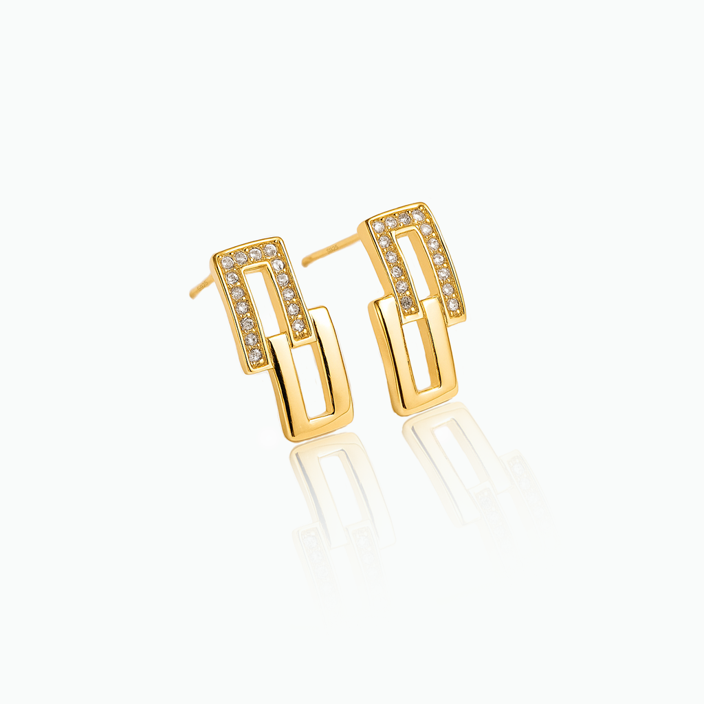 Gold hoop earrings with embedded stones on a white background