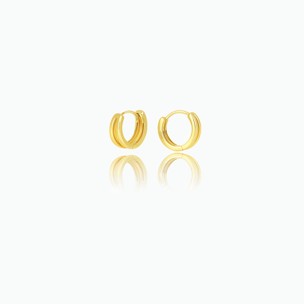 Gold hoop earrings on a white background