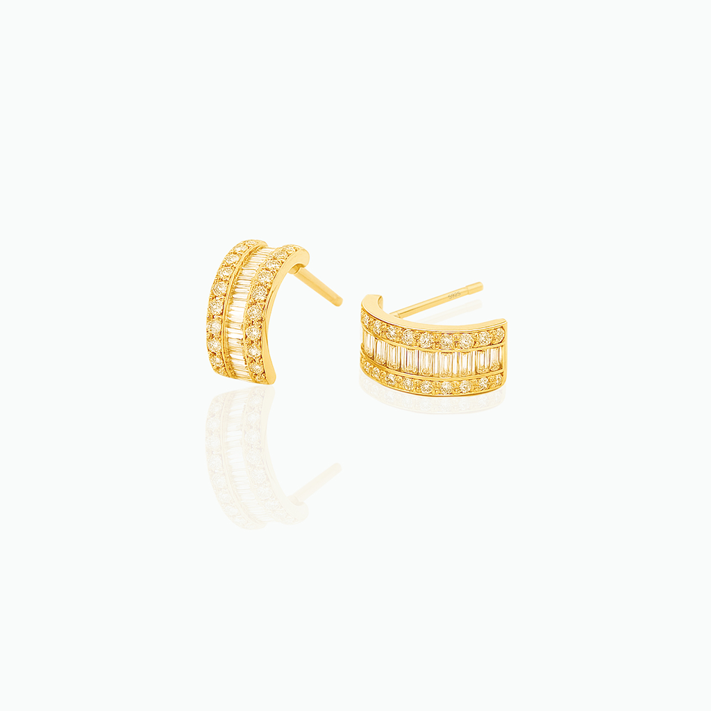 Gold hoop earrings with embedded stones on a white background