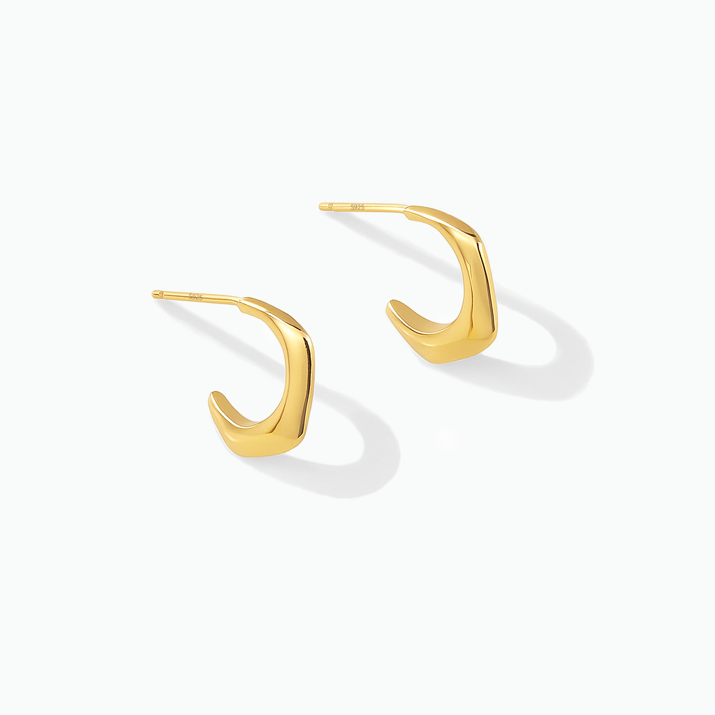 Gold-tone angular hook earrings displayed on a white background
