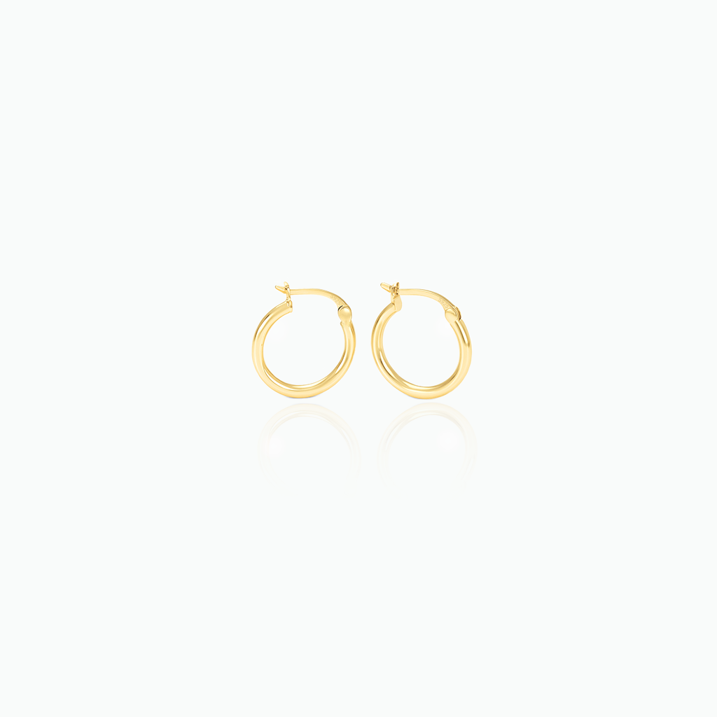 Gold hoop earrings on a white background