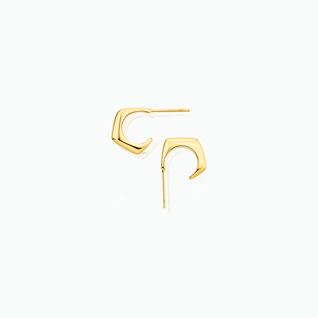 Gold stud earrings on a white background