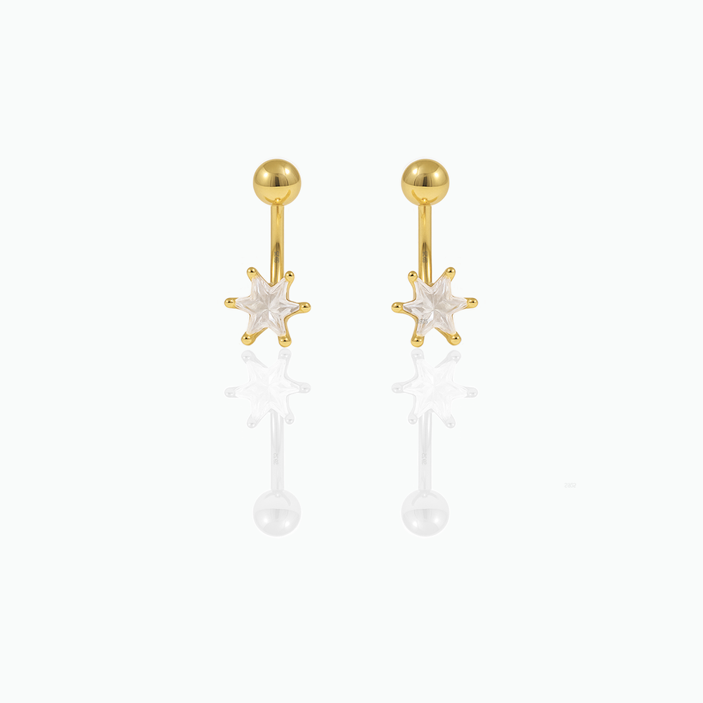 Gold earrings with star-shaped tops on a white background