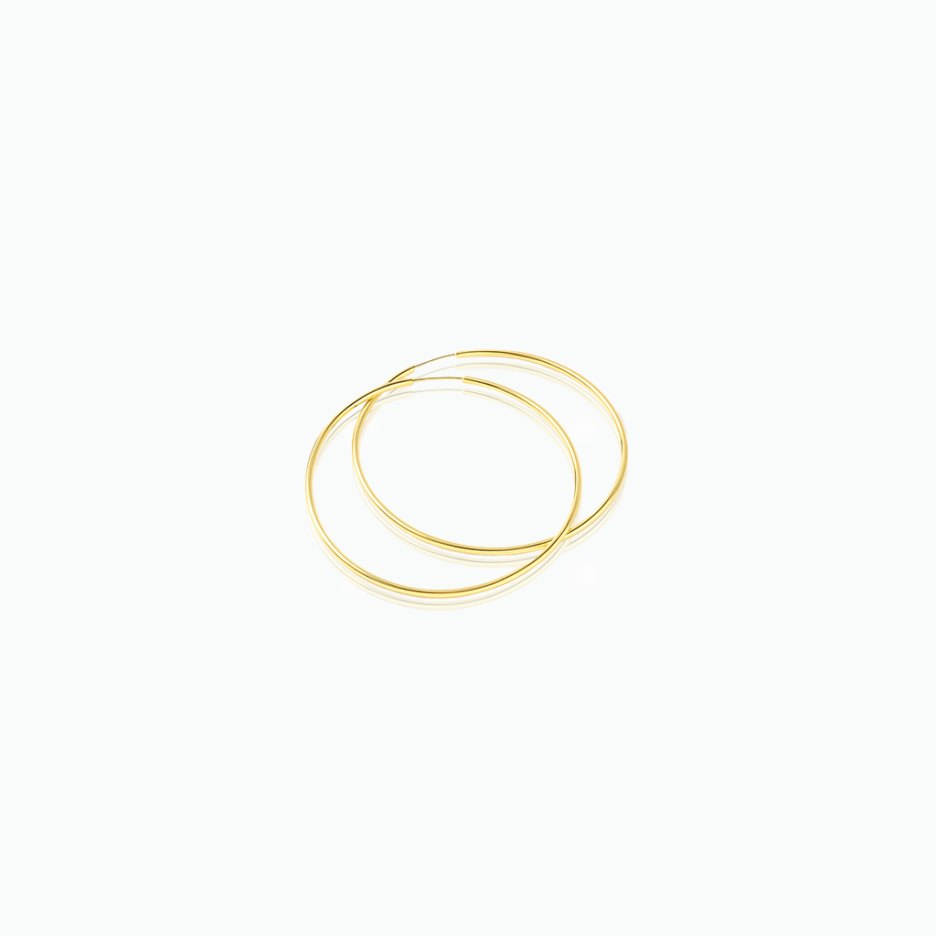 Gold hoop earrings on a white background