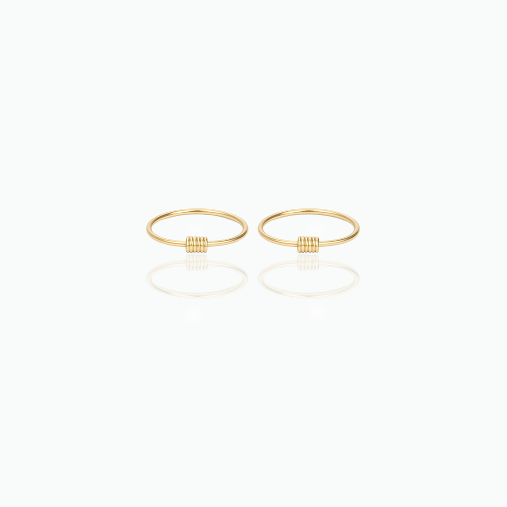 Pair of gold hoop earrings on a white background