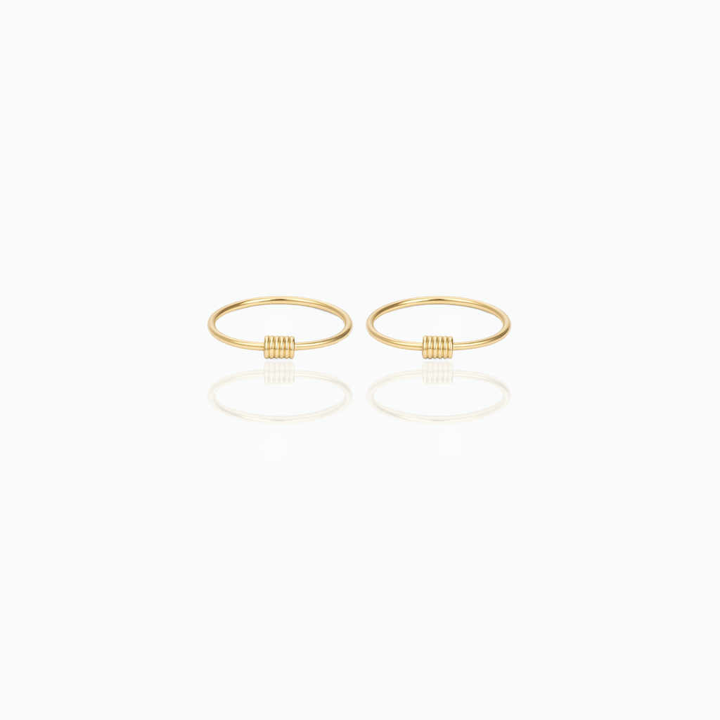Pair of gold hoop earrings on a white background