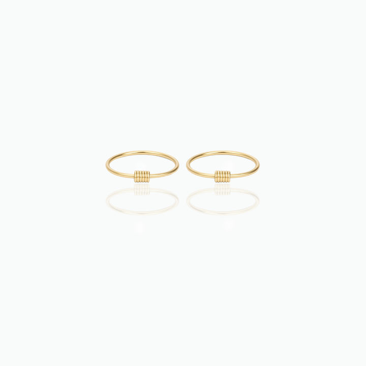 Pair of gold hoop earrings on a white background