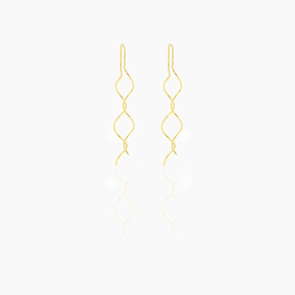 Gold earrings on a white background