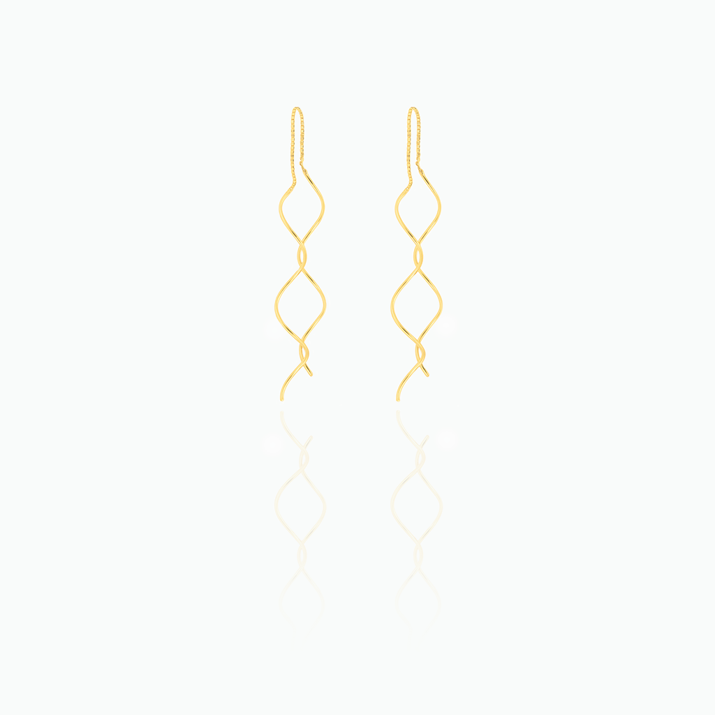 Gold earrings on a white background