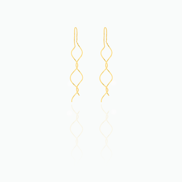 Gold earrings on a white background