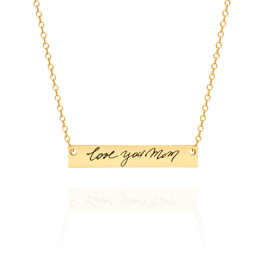 Gold necklace with 'love you Mom' pendant on a white background