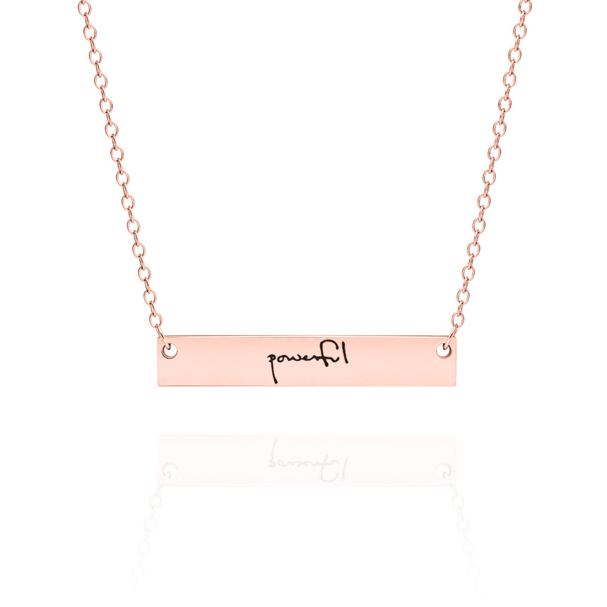 Rose gold necklace with 'powerful' bar pendant on a white background