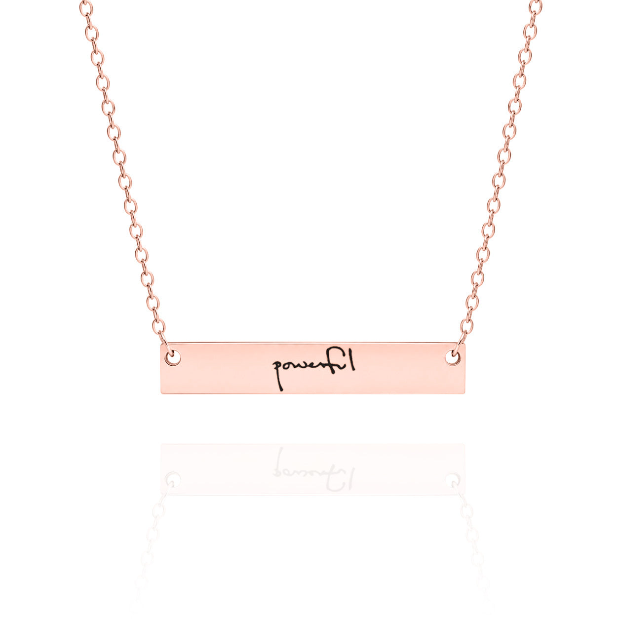 Rose gold necklace with 'powerful' bar pendant on a white background