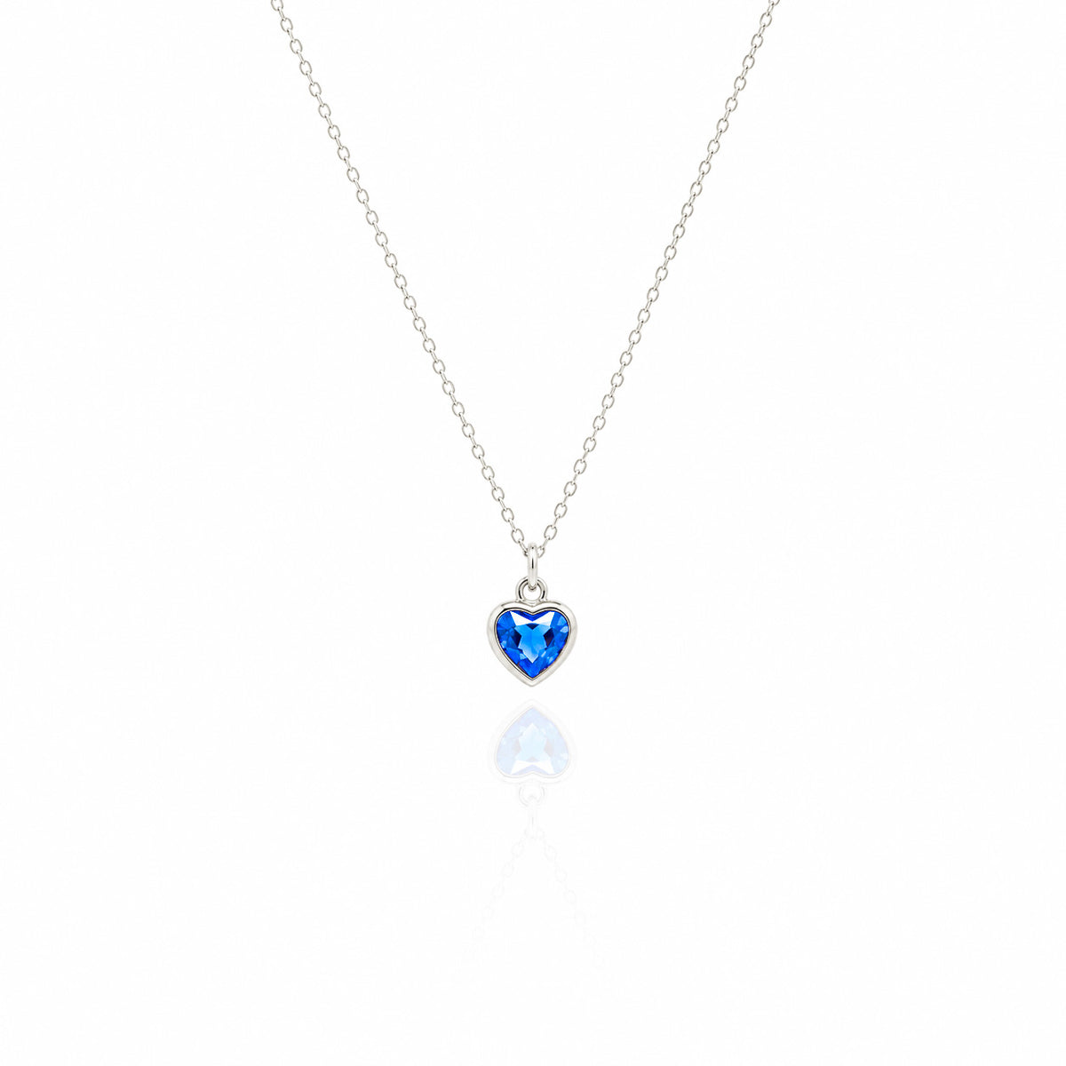 Heart-shaped blue gemstone necklace on a white background