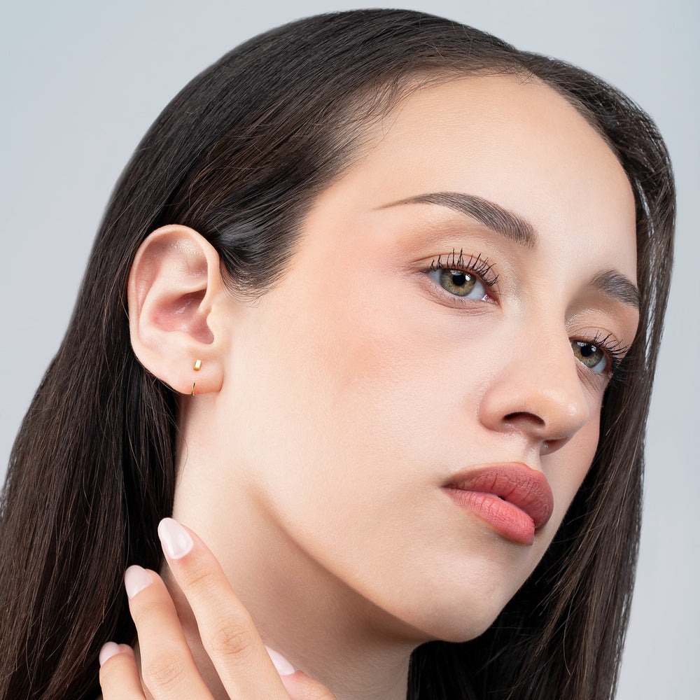 Close-up of a woman's face with a neutral background