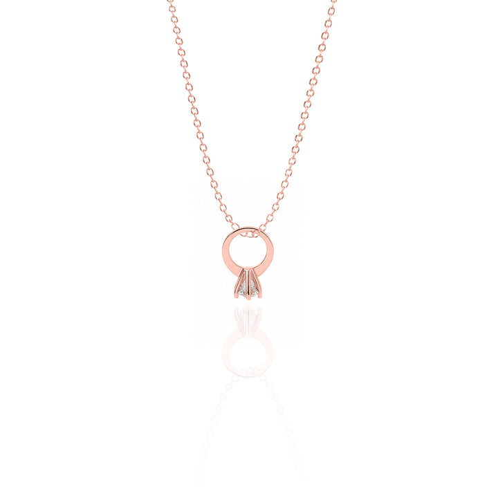 Rose gold necklace with a circular pendant on a white background