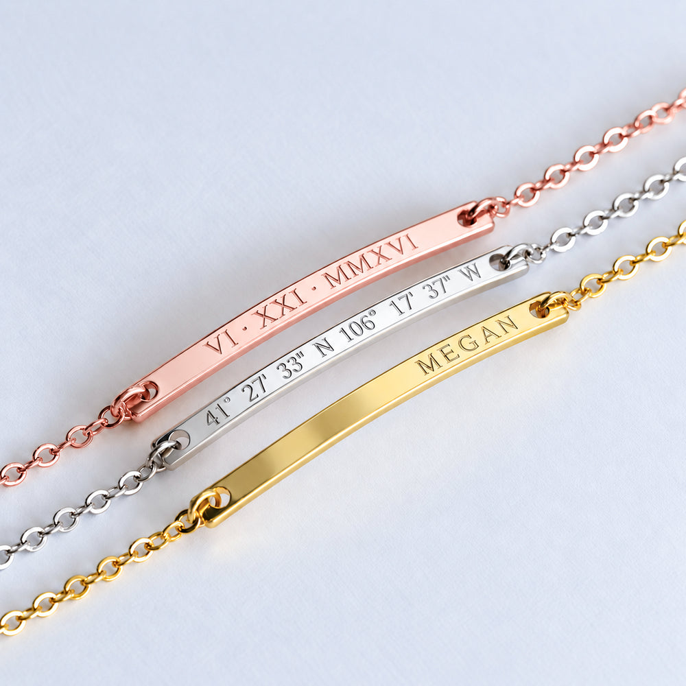 Three personalized bar bracelets in rose gold, silver and gold finishes with engraved date, coordinates and name

