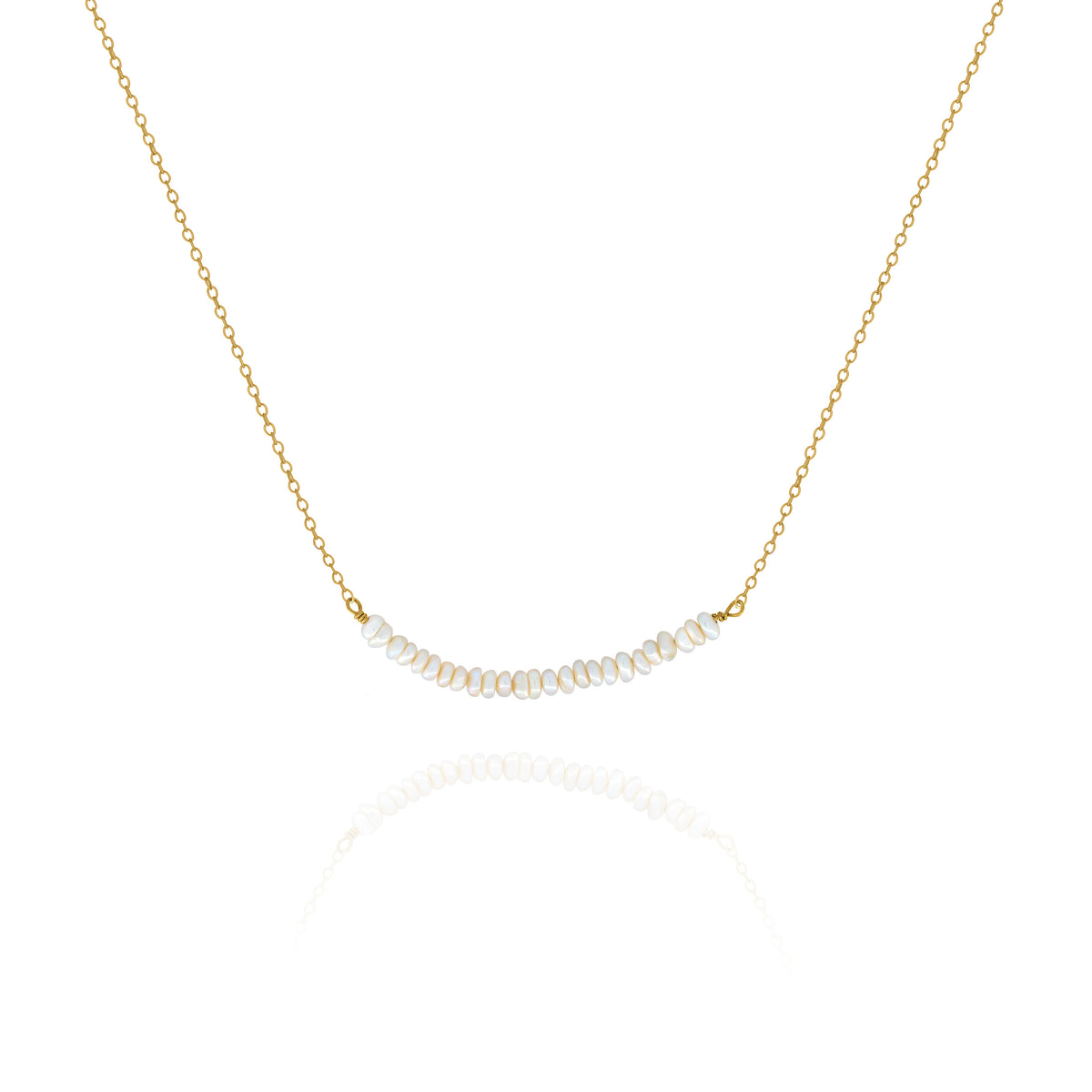Gold-tone necklace with a centered row of small white pearls on a white background