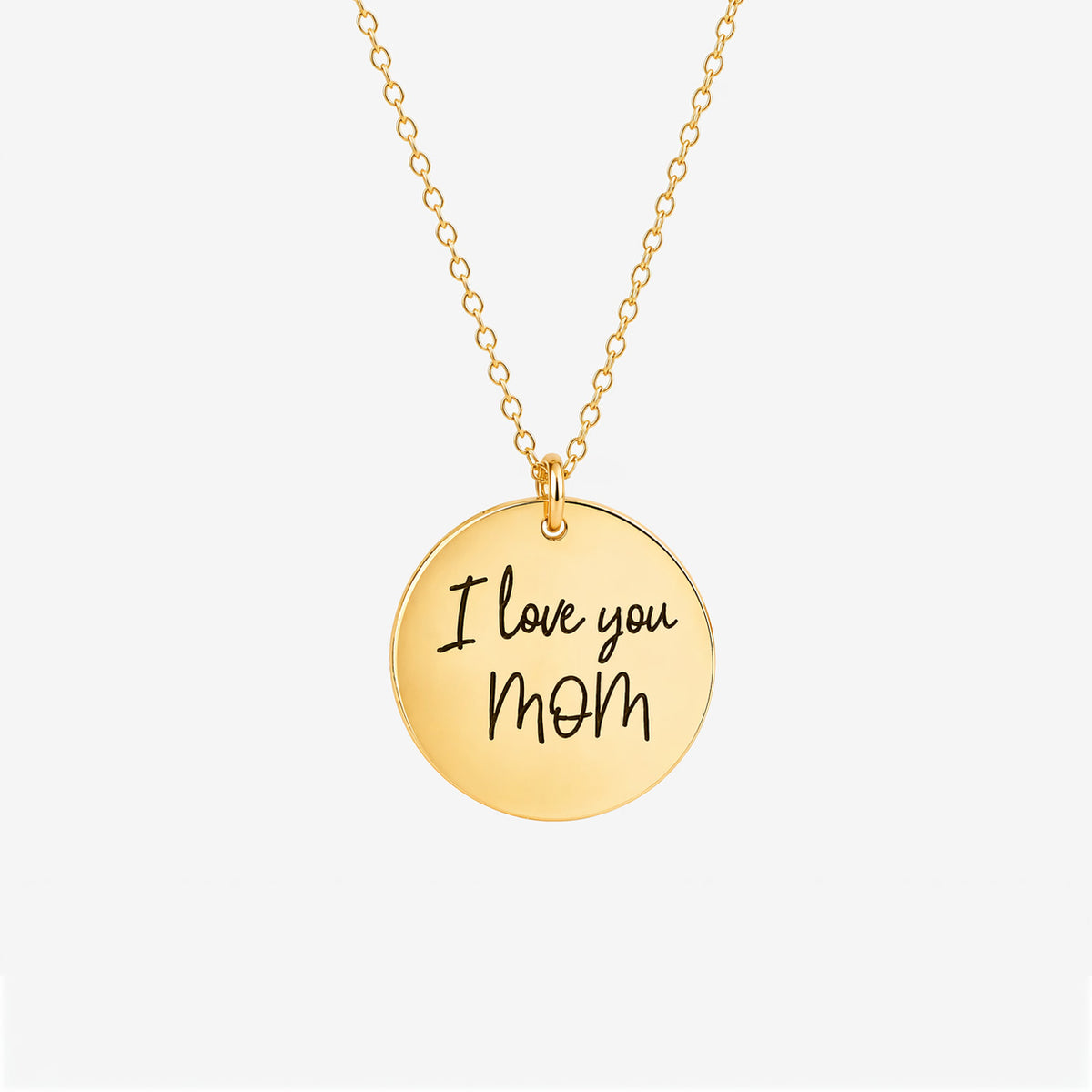 Gold-tone round pendant necklace engraved I love you Mom in handwritten script on a white background