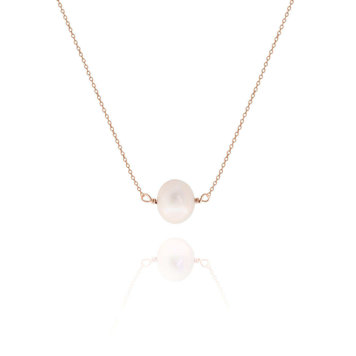Rose-gold-tone necklace with a single white pearl centered on a delicate chain on a white background