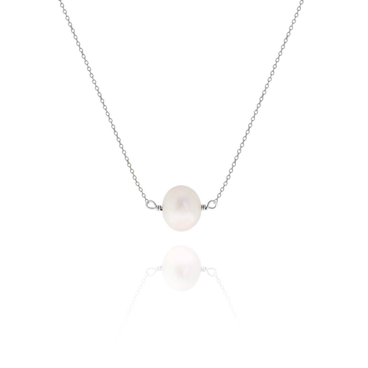 Silver-tone necklace with a single white pearl centered on a delicate chain on a white background